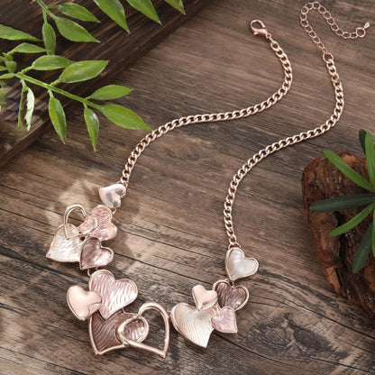 Multi-heart enamel necklace styled on model JeevaFashions
