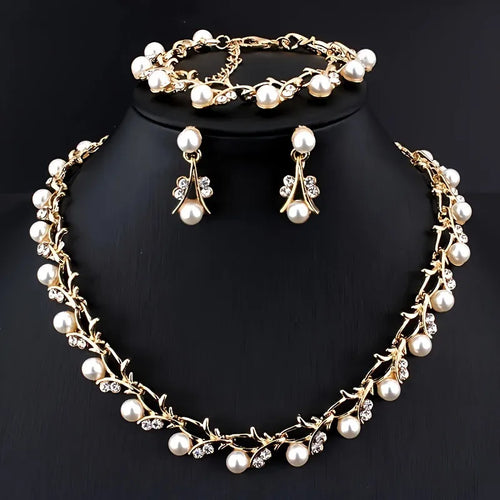 Faux pearl jewellery set with necklace earrings and bracelet in gold tone – festive wear for women