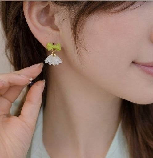 Pearl petal charm earrings styled for casual wear JeevaFashions