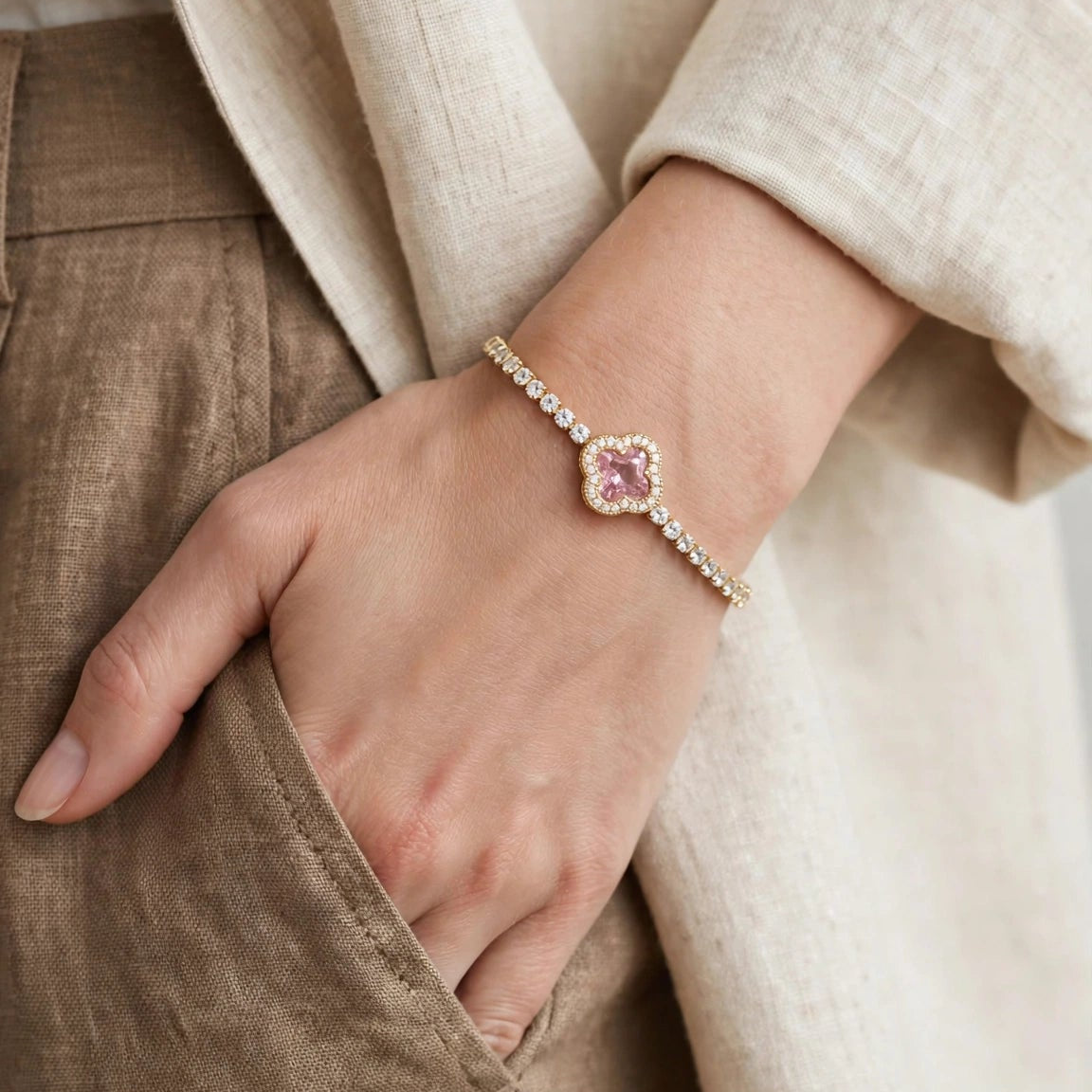 Pink clover motif close up on gold bracelet for women JeevaFashions