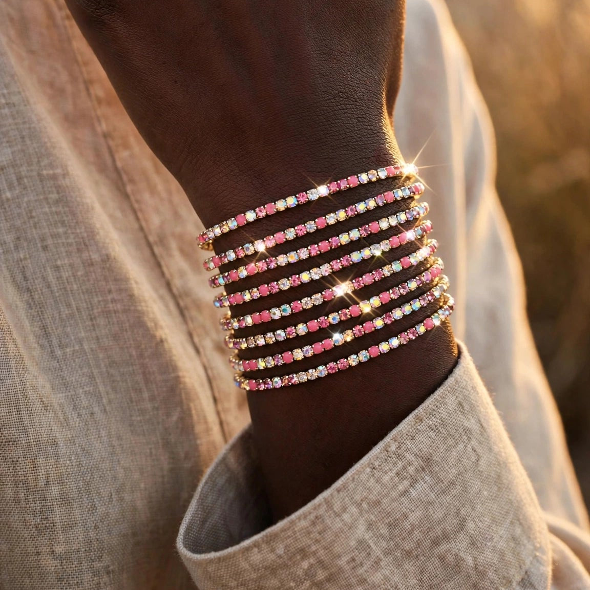 Pink crystal chain bangle stacked with gold bracelets for women at JeevaFashions