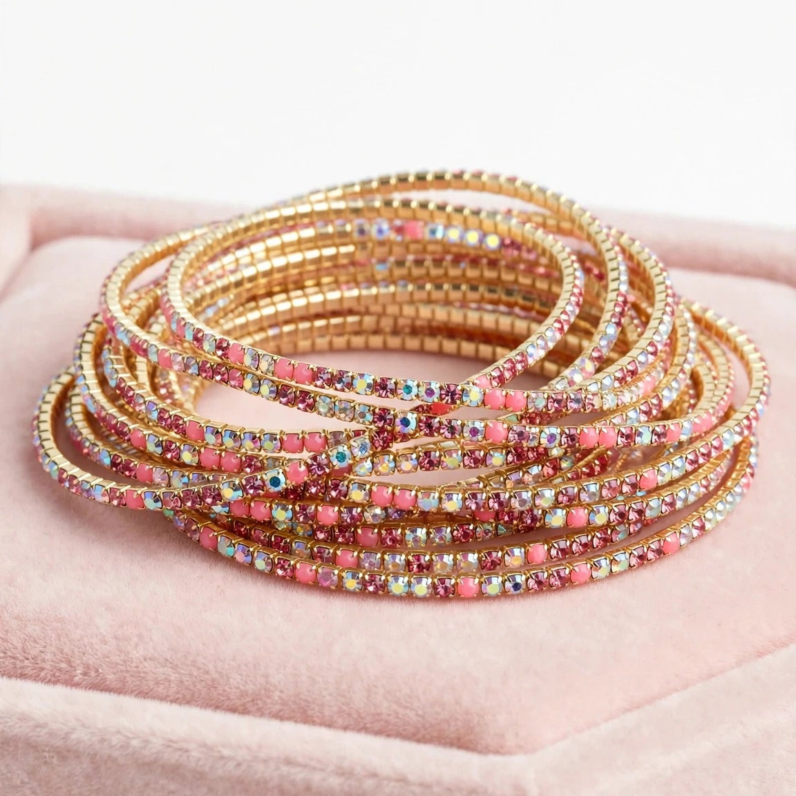 Pink crystal chain bangle styled on wrist for women at JeevaFashions