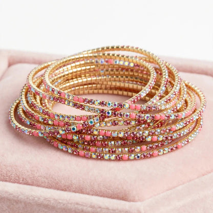 Pink crystal chain bangle styled on wrist for women at JeevaFashions