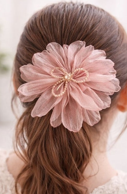 Pink floral statement hair clip styled on hair JeevaFashions