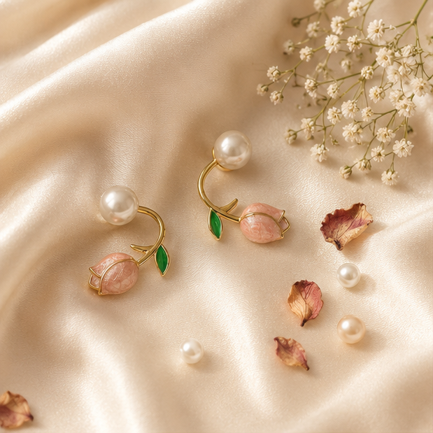 Close-up of pink tulip and pearl stud earrings with green enamel leaf on gold-tone vine – floral everyday earrings for Indian women