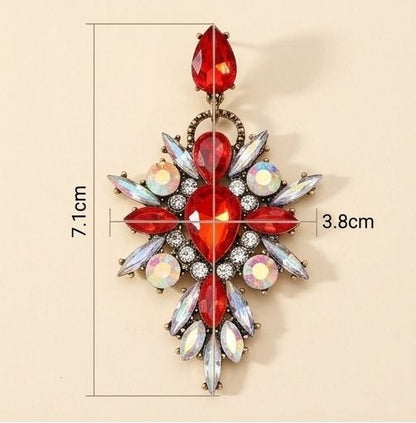 Red crystal earrings styled on model JeevaFashions
