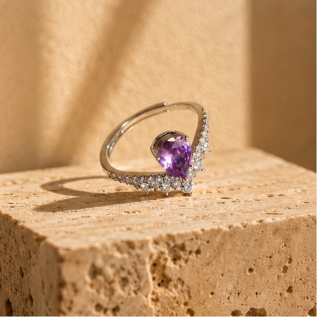 Pear amethyst CZ cocktail ring close up, rhodium plated, party wear for women at JeevaFashions