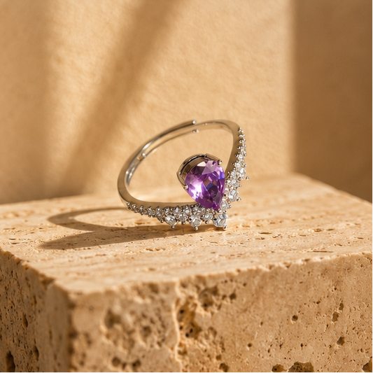 Pear amethyst CZ cocktail ring close up, rhodium plated, party wear for women at JeevaFashions