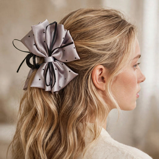 Alternate angle of silver satin polka dot bow hair claw clip