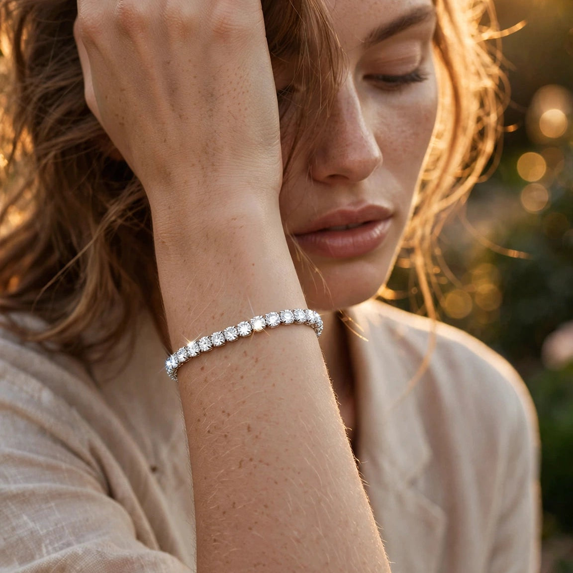 silver tone slim CZ tennis bracelet worn on wrist for women JeevaFashions