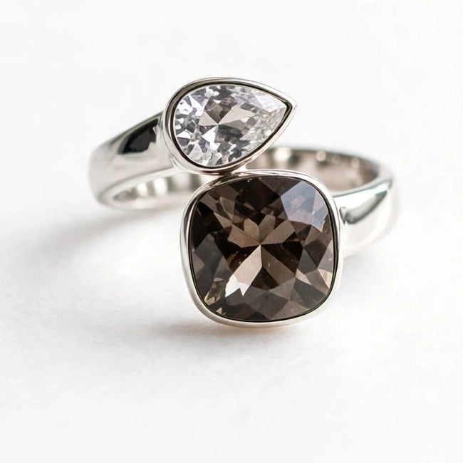Two-tone crystal ring with clear and smoky brown stones on white background for women at JeevaFashions