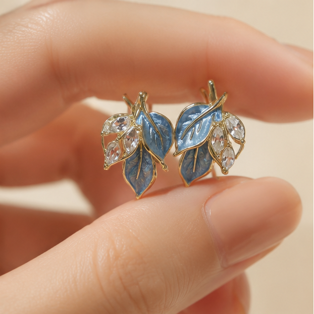 Sky blue trefoil stud earrings styled on model JeevaFashions
