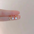 Sparkling crystal swan pearl stud earrings gold plated JeevaFashions