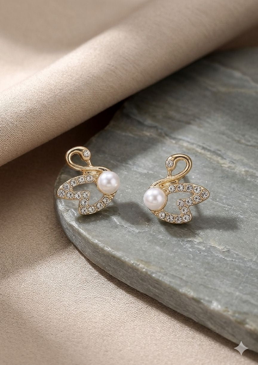 Swan pearl stud earrings styled for weddings JeevaFashions