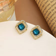 Teal CZ stud earrings gold tone halo for women JeevaFashions