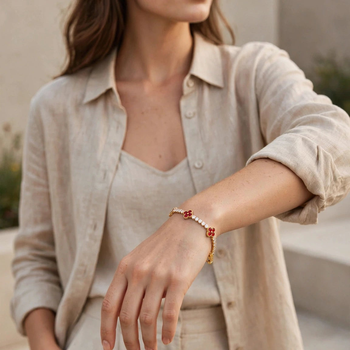 Red clover motif close up on gold tennis bracelet for women JeevaFashions