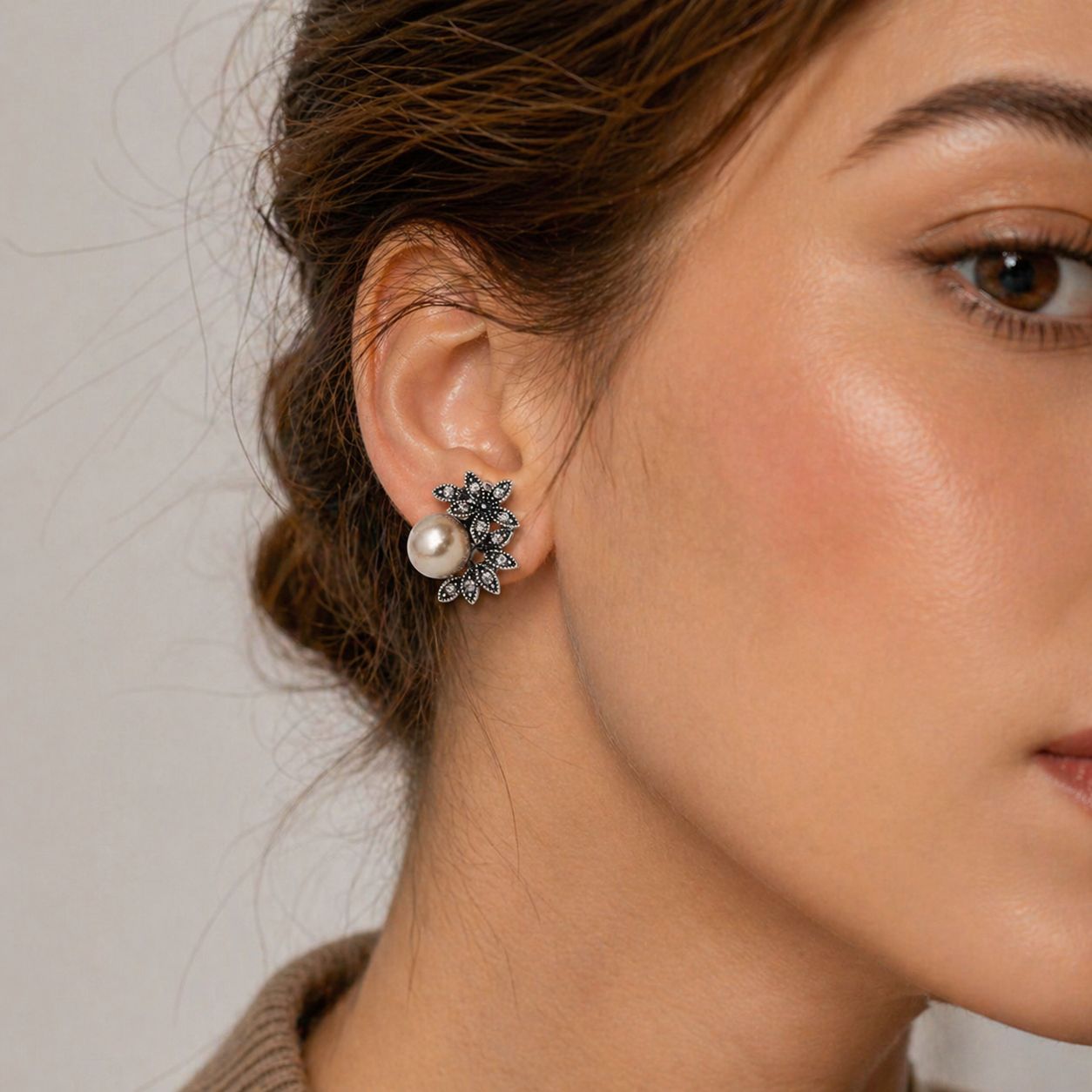 Close-up of vintage pearl stud earrings with sparkling crystal floral setting – anti-tarnish leverback earrings for Indian women