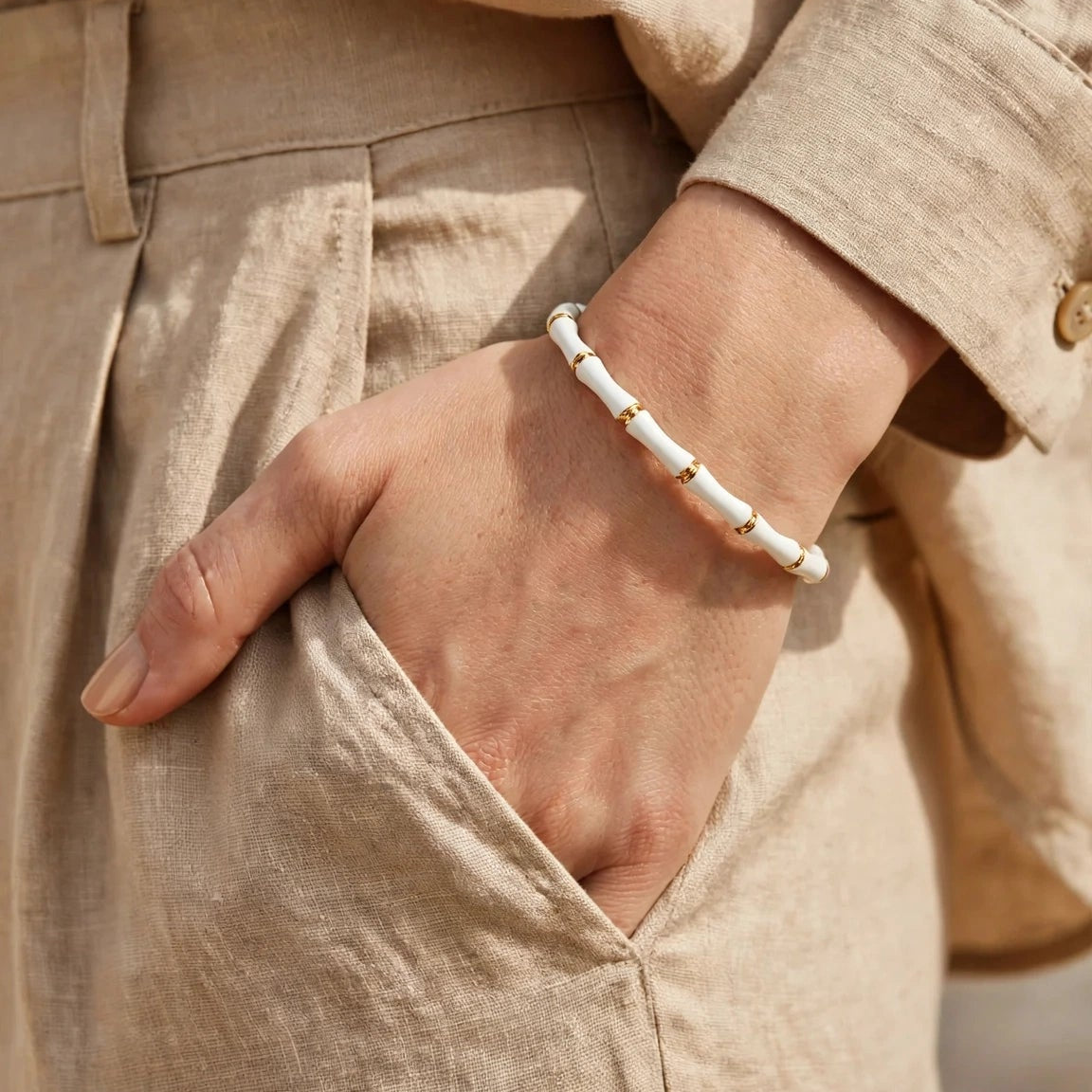White enamel bamboo bracelet styled on wrist for women at JeevaFashions