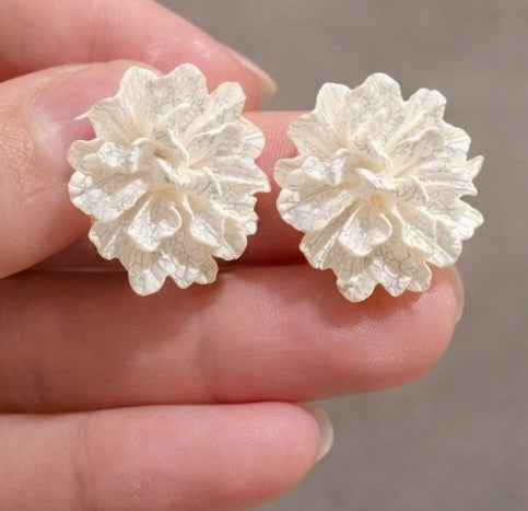 White floral earrings styled for daily and festive wear JeevaFashions