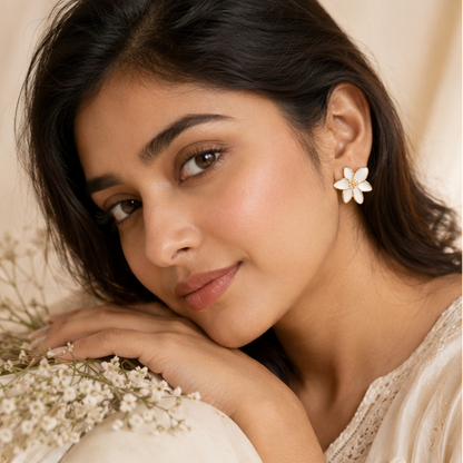 Gold tone white lily petal earrings closeup JeevaFashions