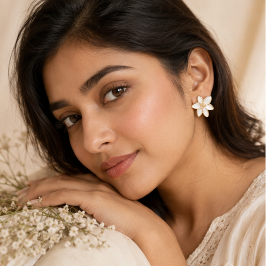 Gold tone white lily petal earrings closeup JeevaFashions